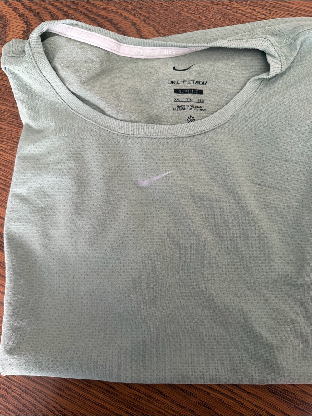 Nike women’s Dri-FIT Light Green Short Sleeve Athletic Shirt